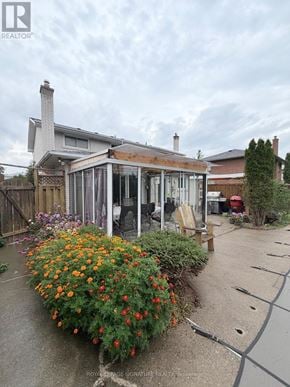 Mississauga (Applewood) apartment for rent - A house with a garden in front of it.