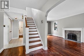 Toronto (Islington-City Centre West) apartment for rent - A spacious room with a staircase leading to the upper floor.