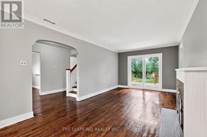 Toronto (Islington-City Centre West) apartment for rent - A room with wooden floors and a window overlooking a green area.