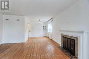 Toronto (Edenbridge-Humber Valley) apartment for rent - A room with a fireplace and wooden floors.