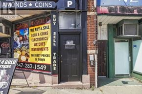Toronto (Briar Hill-Belgravia) apartment for rent - A storefront with a sign that says "4 GOLD" and a phone number.