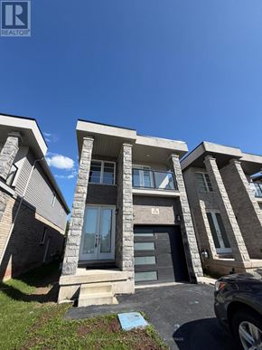 Welland (Lincoln/Crowland) apartment for rent - A modern house with a stone facade and a car parked in front.