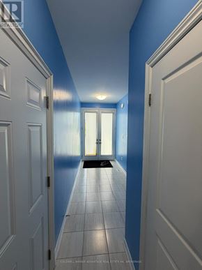 Welland (Lincoln/Crowland) apartment for rent - A hallway with white doors and a tiled floor.