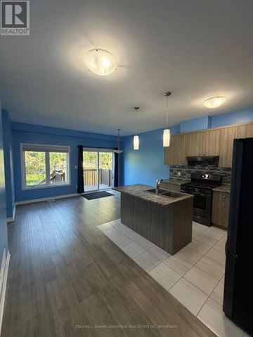 Welland (Lincoln/Crowland) apartment for rent - A kitchen with a sink and a stove top oven.