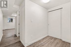Ottawa apartment for rent - A room with a sliding door and a window in the background.