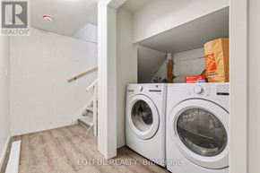 Ottawa apartment for rent - A laundry room with a washer and dryer in it.