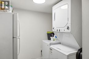 Windsor apartment for rent - A white industrial washing machine in a laundry room.