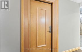 Toronto (Mount Pleasant West) condo for rent - A wooden door with a handle and a lock.