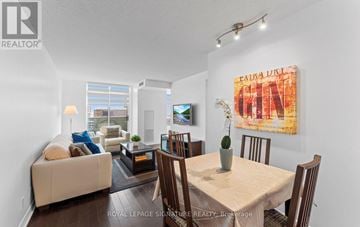 Toronto (Mount Pleasant West) condo for rent - A living room with a couch, a coffee table, a dining table and chairs.