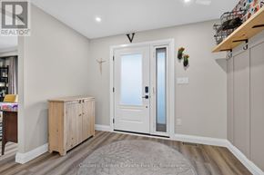 Halton Hills (Georgetown) apartment for rent - A room with a white door and a wooden cabinet.