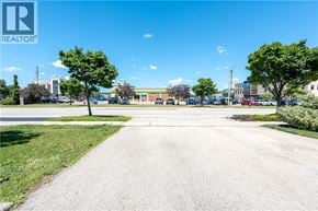 Burlington townhouse for rent - A sunny day at a realtor's property with a clear blue sky.