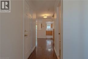 Burlington townhouse for rent - A long hallway with a door on the left and a door on the right.