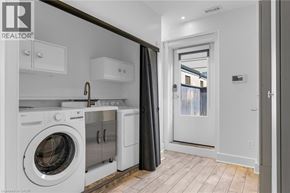 Hamilton apartment for rent - A laundry room with a washer and dryer.