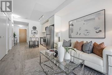 Toronto (Bayview Village) condo for rent - A modern living room with a glass coffee table and a large abstract painting on the wall.
