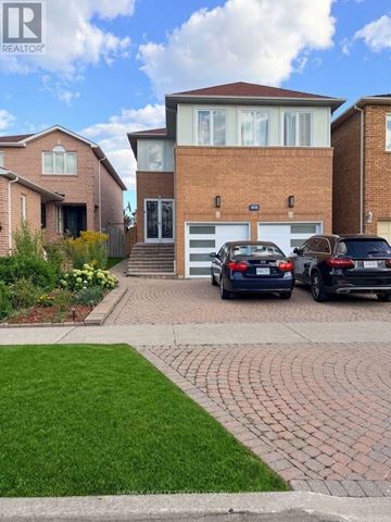 Mississauga (East Credit) apartment for rent - A house with a brick facade has a car parked in front of it.