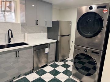 Mississauga (East Credit) apartment for rent - A stainless steel dishwasher is in a kitchen with a checkered floor.