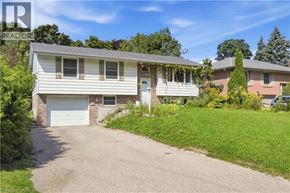 Waterloo apartment for rent - A house with a white garage door is for sale.