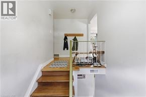Waterloo apartment for rent - A room with a staircase leading to the second floor.