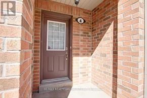 Mississauga (Lakeview) townhouse for rent - A brown door with a glass window is numbered 4.