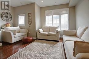 Mississauga (Lakeview) townhouse for rent - A living room with white furniture and a rug.