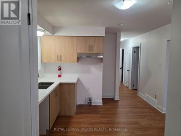 Pickering (West Shore) apartment for rent - A kitchen with wooden cabinets and a white countertop.