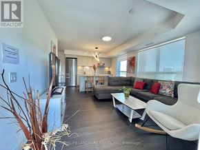 Markham (Unionville) condo for rent - A living room with a white couch and a coffee table.