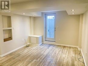 Milton (Cl Clarke) apartment for rent - A room with wooden flooring and a window.