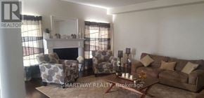 Brampton (Credit Valley) apartment for rent - A living room with a fireplace and a couch.