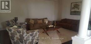 Brampton (Credit Valley) apartment for rent - A living room with a couch, chair, and coffee table.