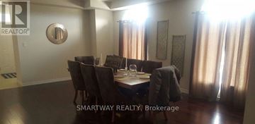 Brampton (Credit Valley) apartment for rent - A dining room with a table set for six with a view of the hallway.