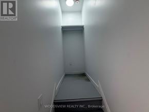 Toronto (Junction Area) apartment for rent - A hallway with a light on the ceiling and a door at the end.