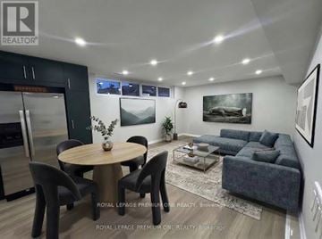 Toronto (Eringate-Centennial-West Deane) apartment for rent - A modern living room with a dining table and chairs.