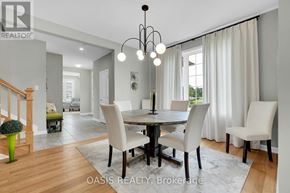 Ottawa apartment for rent - A dining room with a table set for four and a chandelier hanging from the ceiling.