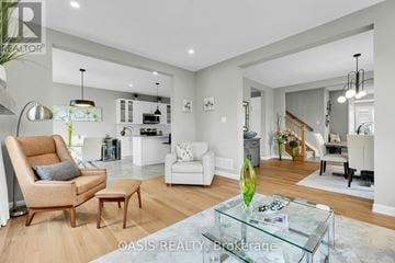 Ottawa apartment for rent - A modern living room with a glass coffee table and a sofa.