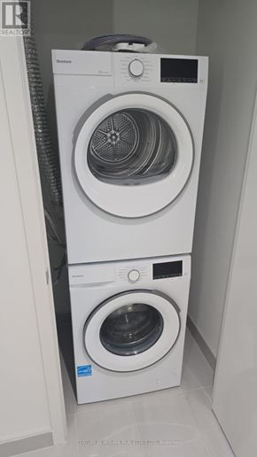 Toronto (Annex) condo for rent - A white washing machine and dryer stacked on top of each other.
