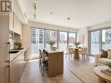 Toronto (Willowdale East) condo for rent - A modern kitchen with a dining table and chairs.