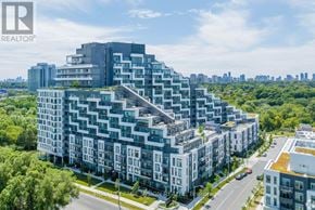 Toronto (Bayview Village) condo for rent - A modern apartment complex with a mix of grey and white buildings.