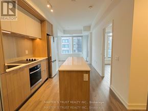 Mississauga (City Centre) condo for rent - A kitchen with wooden cabinets and a countertop.