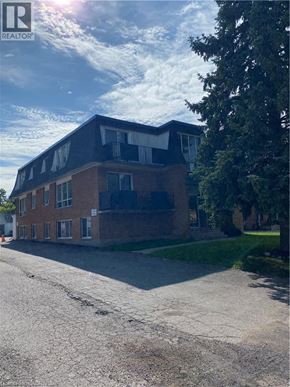 New Hamburg apartment for rent - A building with a sign that says REALTOR in the upper left corner.