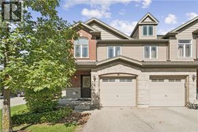 Guelph townhouse for rent - A two-story house with a garage on the side.