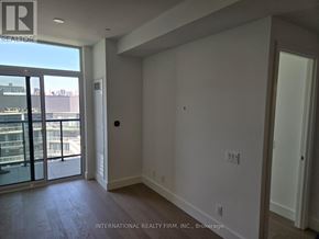 Toronto (Bayview Village) condo for rent - A room with a sliding glass door leading to a balcony.