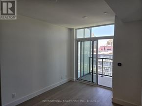 Toronto (Bayview Village) condo for rent - A room with a sliding glass door leading to a balcony.
