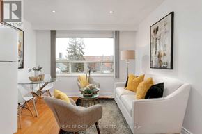 Toronto (Oakwood Village) apartment for rent - A living room with a white couch and a glass table.