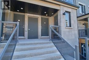 Clarington (Bowmanville) townhouse for rent - A set of stairs leading to a glass door entrance.