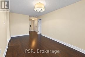 Oakville (Oo Old Oakville) condo for rent - A room with wooden floors and a chandelier.