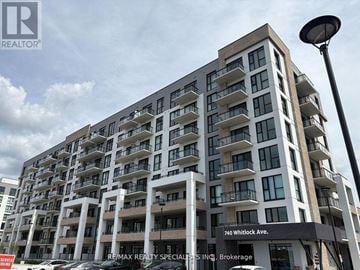Milton (Cb Cobban) condo for rent - A tall building with the sign 740 Whitlock Ave. in front of it.