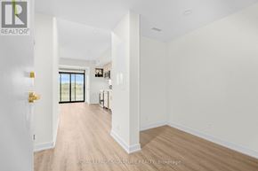 Welland (Broadway) condo for rent - A white room with a doorway leading to another room.