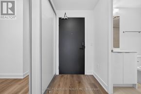 Milton (Tm Timberlea) condo for rent - A room with a black door and white walls.