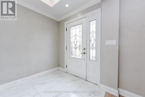 Brampton (Avondale) apartment for rent - A white door with a glass window is in a room with white walls.