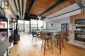 Toronto (Niagara) condo for rent - A modern kitchen with a dining table and chairs.